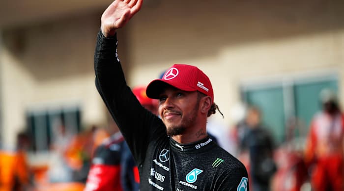 Mercedes driver Lewis Hamilton waves to the crowd at the U.S. Grand Prix.